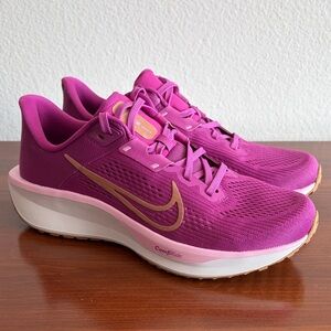 Nike Women’s Pink Running Shoes with Gold Swoosh